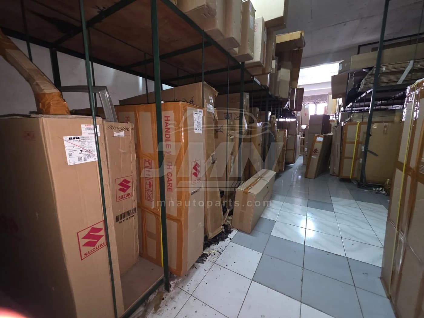 Storage aisle for oversized Suzuki body parts marked handle with care